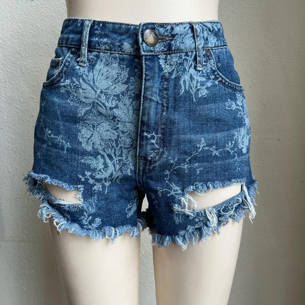 FREE PEOPLE DISTRESSED DENIM SHORTS IN FLORAL PRINT